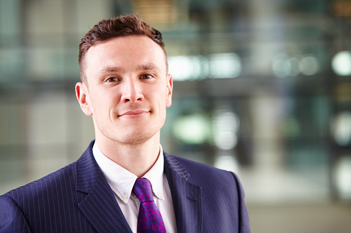 Head and shoulders portrait of a young Caucasian businessman