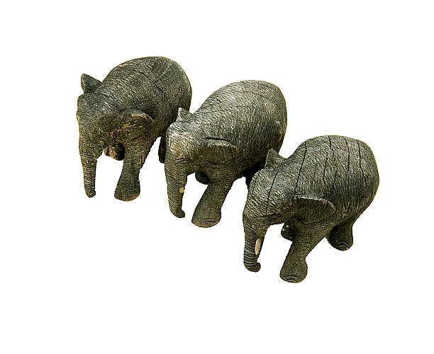 istock Carved wooden elephant on white background 487805134