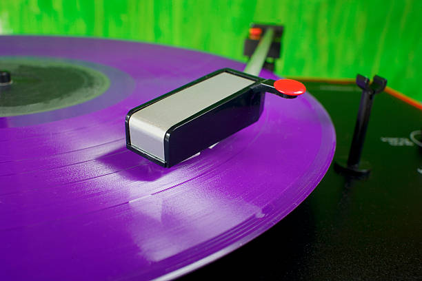 istock Retro turntable with purple vinyl record, 487805258