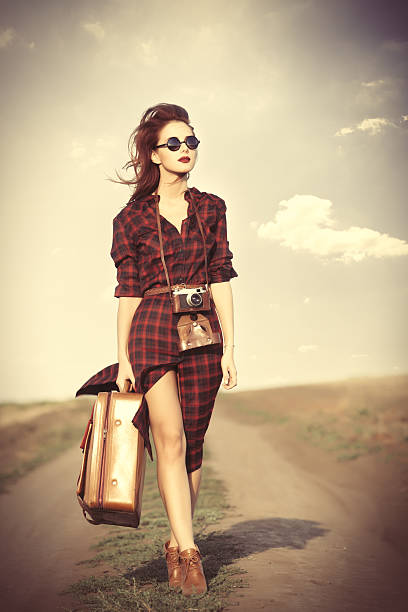 istock girl with bag and retro camera 487805536