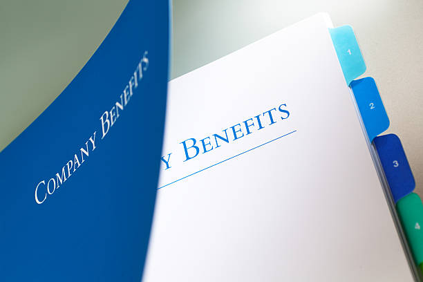 Company Employee Benefits Manual Opening to Outline Employment Occupation Package A corporation employee benefit package manual. instruction manual photos stock pictures, royalty-free photos & images