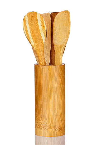 istock Bamboo Container with new Wooden Spoons and real reflection 487805841