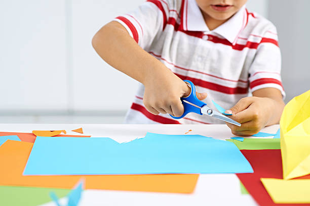 Childish craft Little boy cutting paper for some craftwork preschooler caucasian one person part of stock pictures, royalty-free photos & images