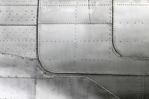 Aircraft siding with rivets