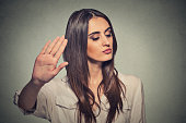 angry woman with bad attitude giving talk to hand gesture