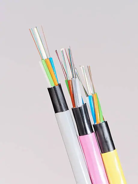 Different colored fiber optic cable ends with stripped jacket layers and exposed colored fibers, Melbourne 2015