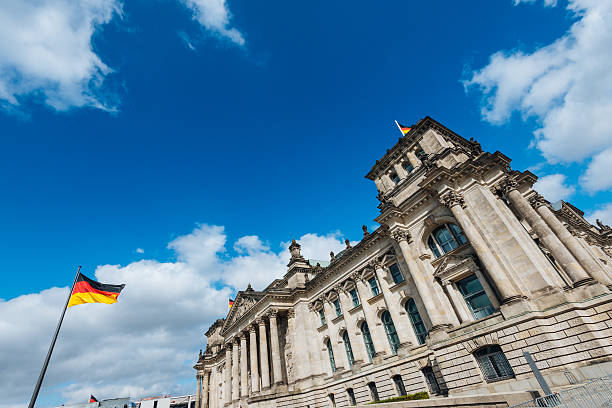 istock Bundestag - German Parliament and waving German flag 487810600