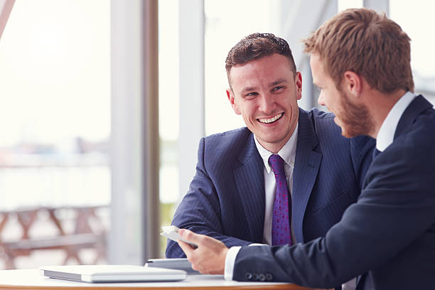 istock Two business colleagues in a meeting, close up 487810624