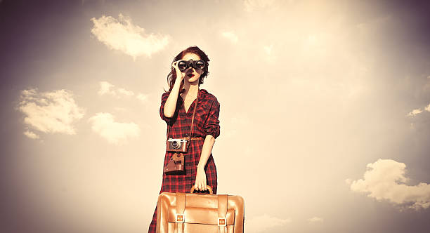 istock girl with bag and binocular 487813484