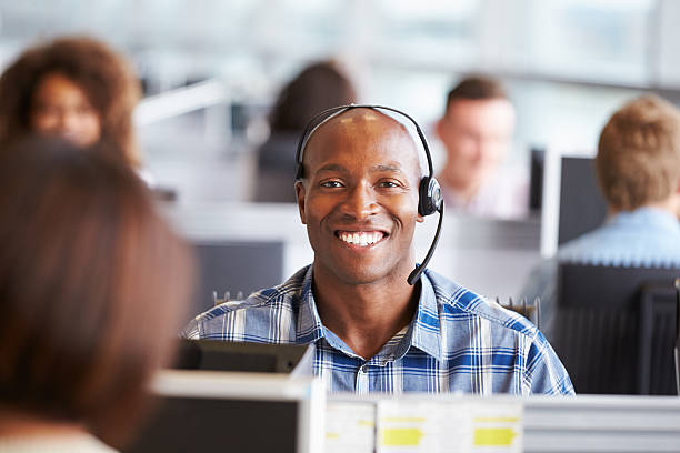 istock African American man working in call centre, looks to camera 487813488