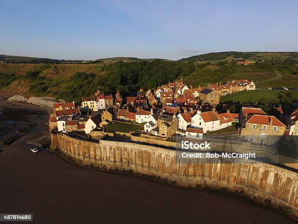 Robin Hoods Bay Sea Wall Stock Photo - Download Image Now - 2015, Cliff, Coastline