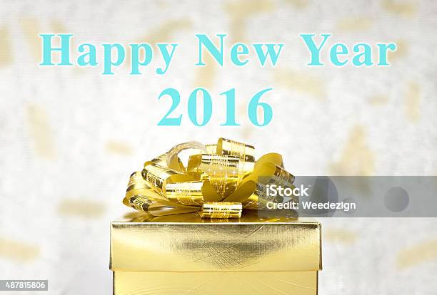 Golden Present With Happy New Year 2016 Word At Bokeh Stock Photo - Download Image Now