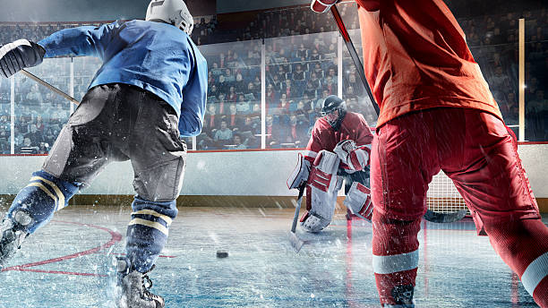 joueur de hockey sur glace des joueurs en action - ice hockey hockey puck playing shooting at goal photos et images de collection