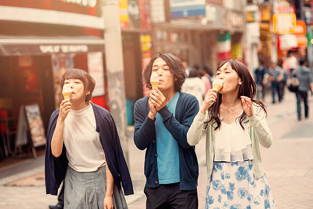 istock Happy japanese friends eating ice cream 487819574