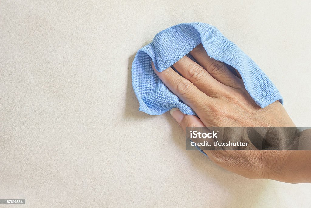 creamy fabric cleaning with a Microfiber Cloth Cleaning Stock Photo