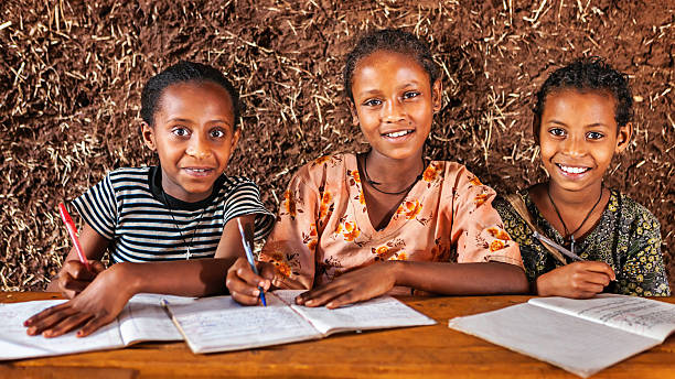 istock African little girls are learning Amharic language 487819838
