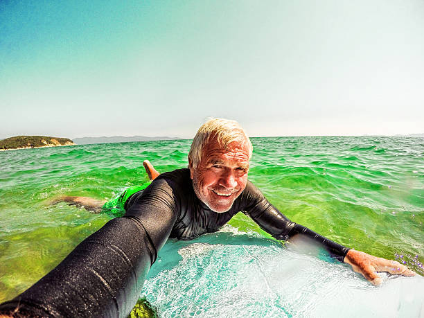 istock Surfing selfie of a senior man 487820364