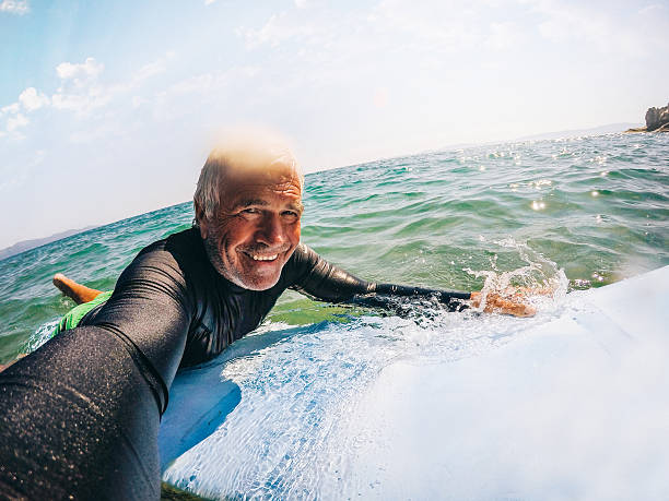 istock Surfing selfie of a senior man 487820392