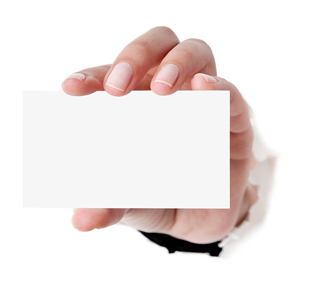 Business card in woman hand on white