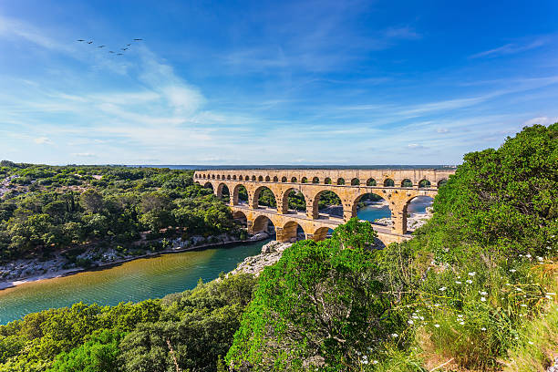 Three-tiered aqueduct Pont du Gard and natural park stock photo