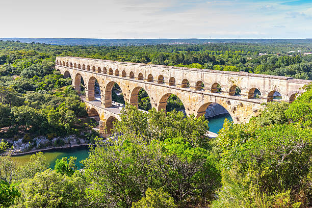istock Three-tiered aqueduct Pont du Gard and natural park 487823672