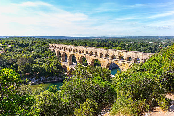 istock Three-tiered aqueduct Pont du Gard and natural park 487823678