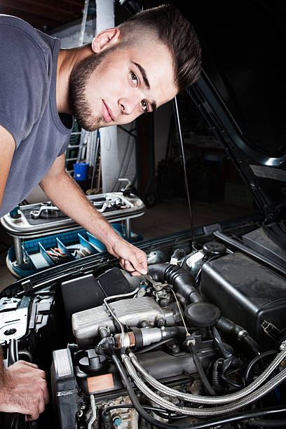 istock Mechanic car repair engine motor 487824048
