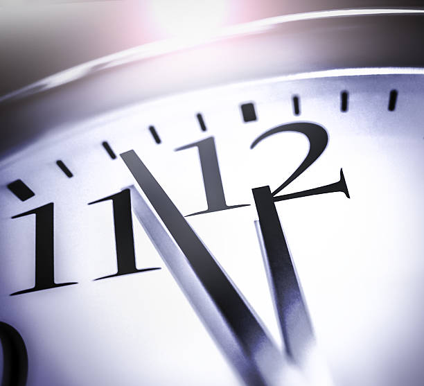 istock Closeup of 12 on a clock signifying a deadline. 487824368