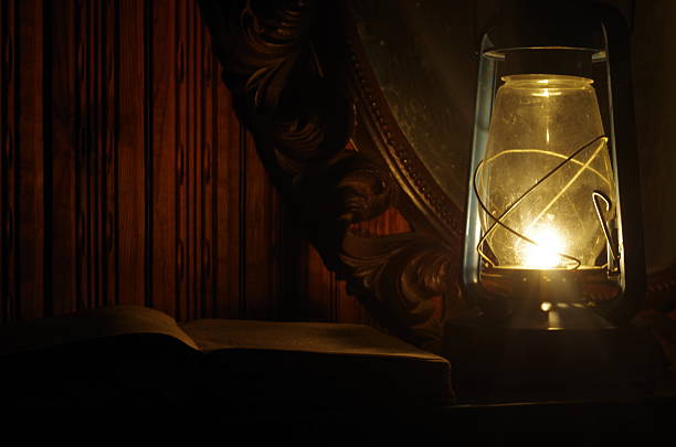 istock Book, oil lamp and mirror in the dark 487826068