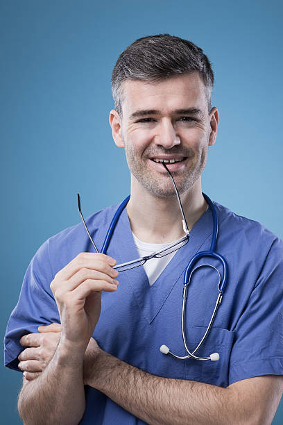 Smiling doctor posing and smiling at camera