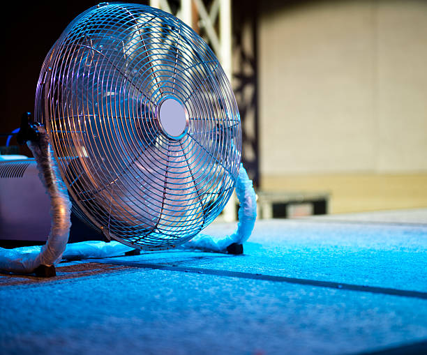 fan electric fan standing on the floor. floor fan stock pictures, royalty-free photos & images