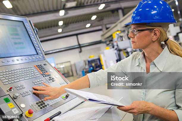 Programming A Cnc Machine Stock Photo - Download Image Now - Machinery, CNC Machine, Factory