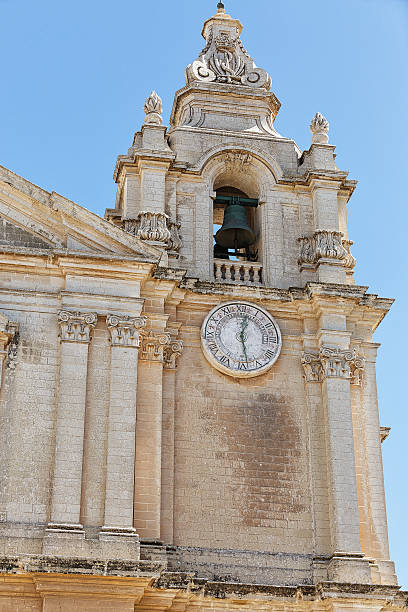 istock Ornate stone carved bell tower and clock 487829035