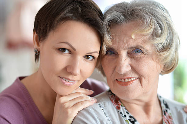 istock older woman and a young woman 487830870