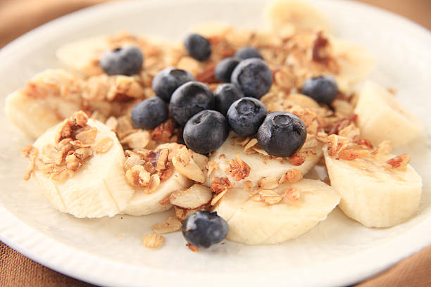 istock Bananas and blueberries with granola 487830932