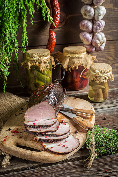istock Freshly sliced smoked ham and marjoram 487831351
