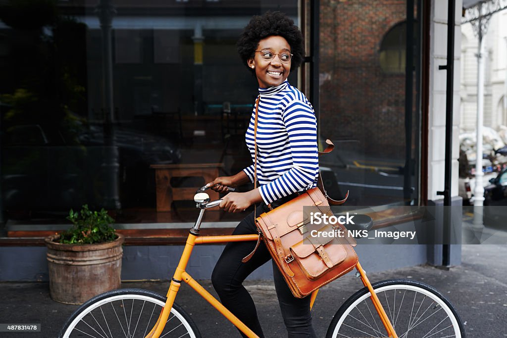 She's smiling at the sights Shot of a young woman out in the cityhttp://195.154.178.81/DATA/i_collage/pu/shoots/805533.jpg Cycling Stock Photo