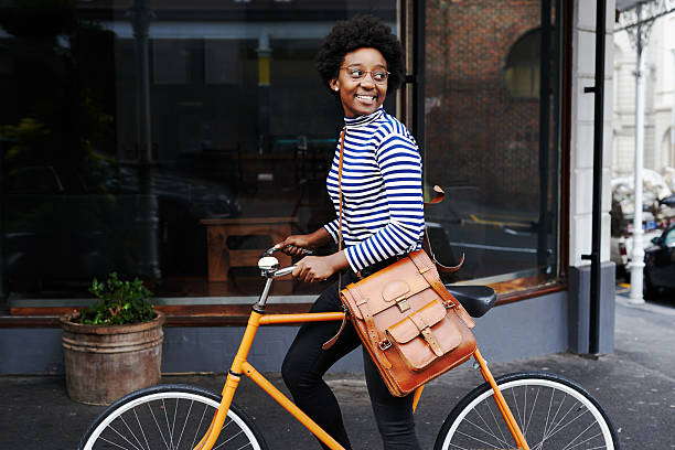 She's smiling at the sights Shot of a young woman out in the cityhttp://195.154.178.81/DATA/i_collage/pu/shoots/805533.jpg bicycle stock pictures, royalty-free photos & images