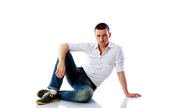 istock Confident man sitting at the floor 487831987