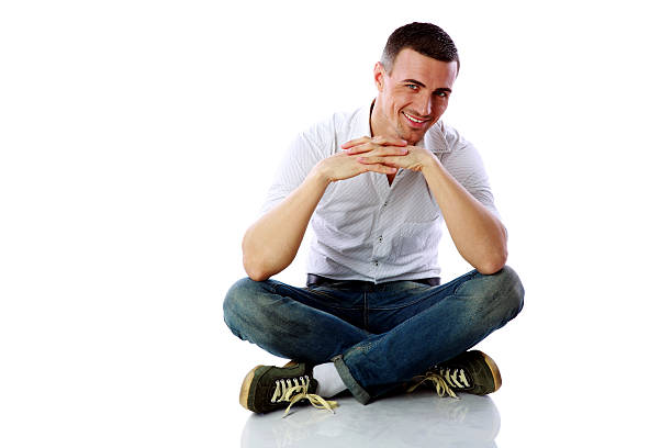 istock Happy man sitting at the floor 487832003