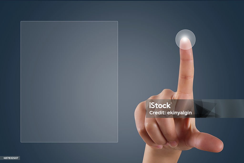 Finger Touching Digital Screen Young female hand finger touching or pressing on digital screen on dark background with copy space area. Accessibility Stock Photo
