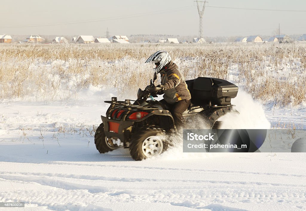 terrain vehicle in motion terrain vehicle in motion at winter sunny day Off-Road Vehicle Stock Photo