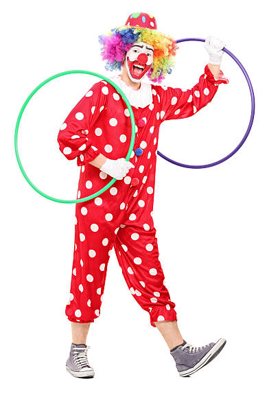 6 year old child playing with a hulahoop isolated on white background.