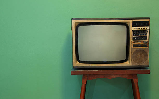 istock Retro television with green background 487834613