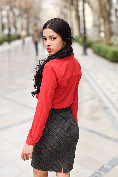 istock Hispanic stewardess in urban background 487834692