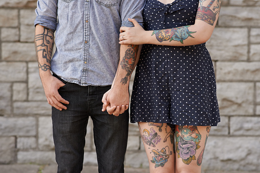 Cropped shot of a couple with tattoos on their bodieshttp://195.154.178.81/DATA/i_collage/pu/shoots/805531.jpg