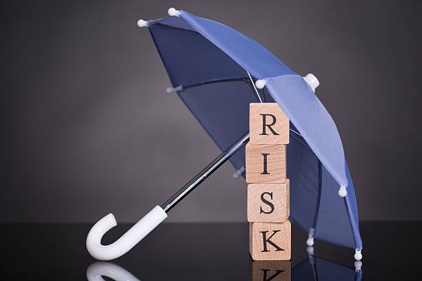 istock Risk Wooden Blocks Under Umbrella 487836378