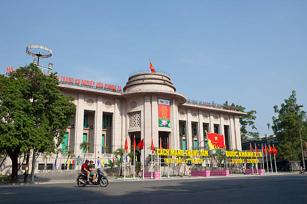 The State Bank of Viet Nam in Hanoi capital Hanoi, Vietnam - August 23, 2015: Motorcycle traveling in front of the building of The State Bank of Viet Nam in Hanoi capital. The State Bank of Vietnam is the central bank of Vietnam and known as the Indochina Bank in the past. indochina stock pictures, royalty-free photos & images