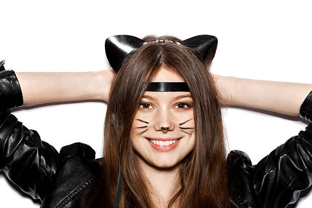 istock Funny girl represents as small cat having fun 487839488