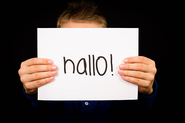 istock Child holding sign with Hallo - Hello in English 487841030